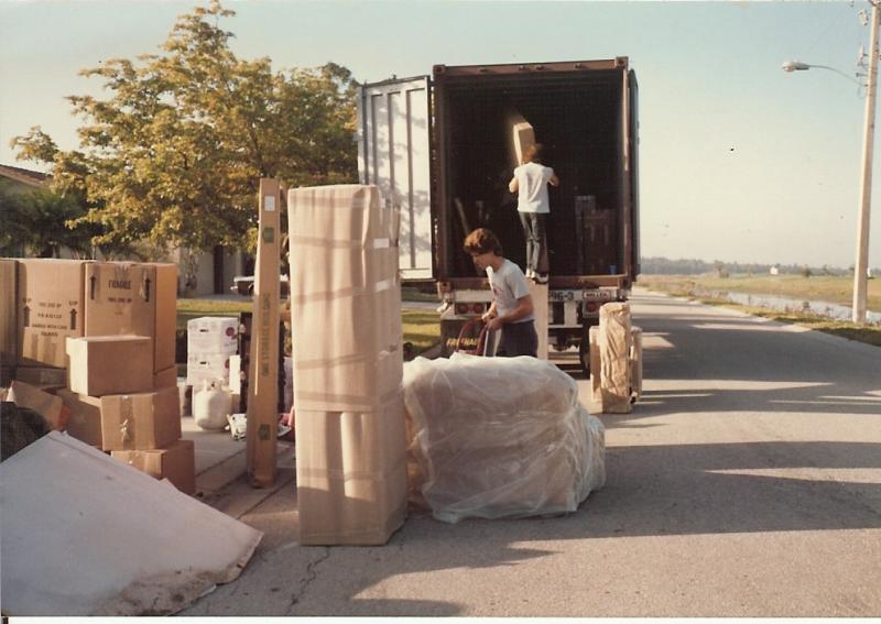 overseas movers loading a container trailer